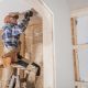 Home restoration in Rhode Island showing exposed framing and licensed contractors at work